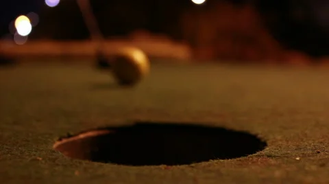Crazy Golf - In the hole - floodlit Stock Footage 987581