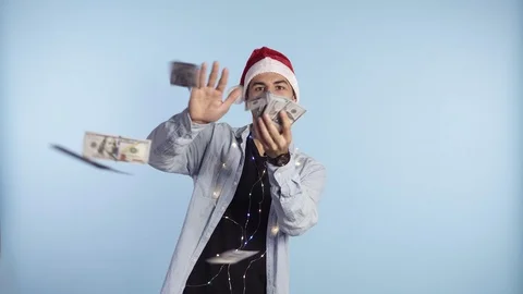 Crazy, handsome excited man throwing dollar banknotes and smiling. Squandering Stock Footage 119254852