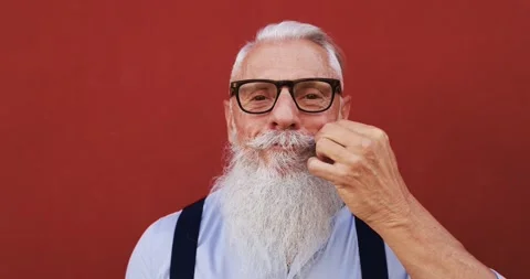 Crazy hipster man touching his moustache in front of the camera Stock Footage 149117268
