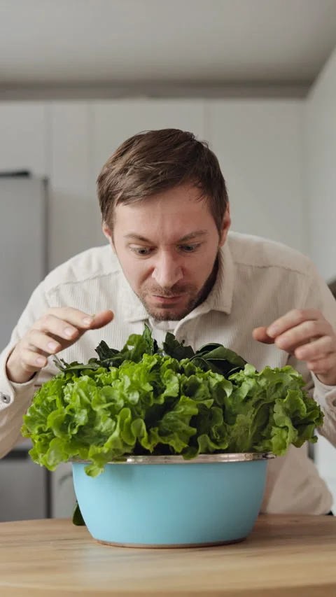 Crazy hungry vegan man eating a healthy fresh salad. Stock Footage 301090205