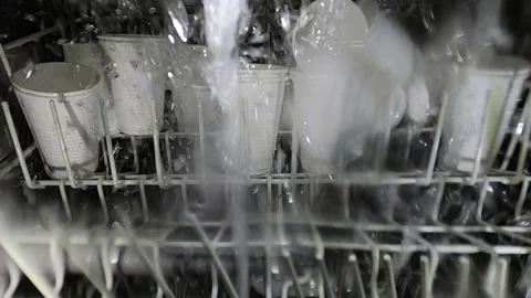 Crazy idea is to wash plastic glasses in the dishwasher. Stock-Footage 199111156