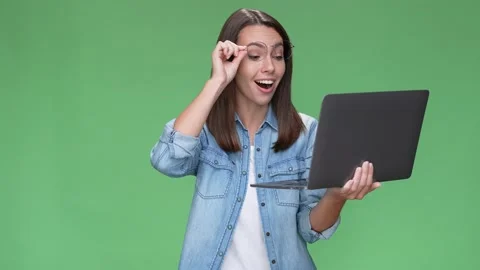 Crazy lady ceo use netbook win fists up shout isolated green color background Stock Footage 166044698
