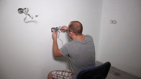 Crazy man get electric shock. Guy shake holding cable Video stock 107298331