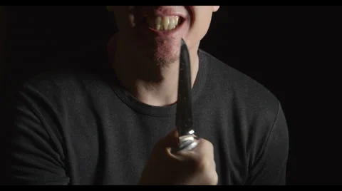 Crazy man with a knife Stock Footage 62588812
