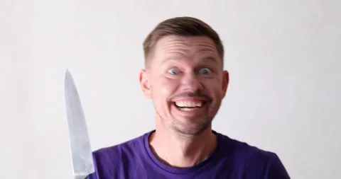 Crazy man looking at camera and waving k... | Stock Video | Pond5