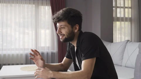 Crazy man with mental illness talking to himself at home alone. 스톡 동영상 222479013