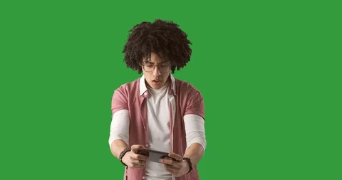 Crazy man playing game on mobile phone Stock Footage 104783524