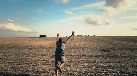 Crazy man running in grassland Stock Footage 27762966