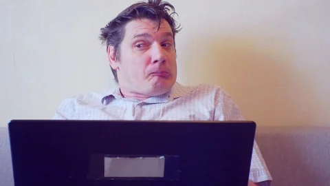 Crazy man sitting at the laptop Video stock 86161576