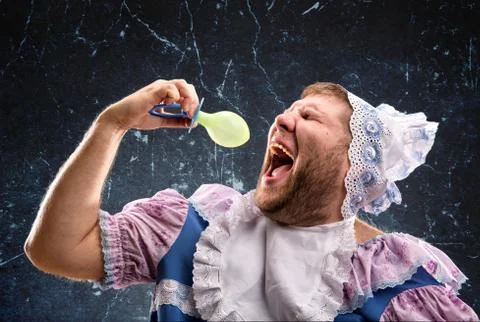 Crazy man sucking a pacifier Stock Photos