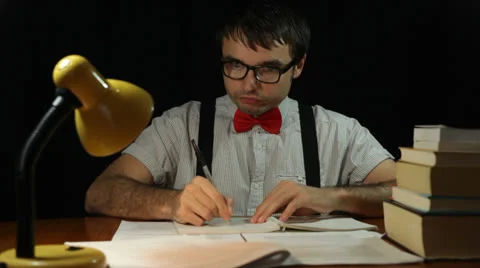Crazy nerd man writing at night 库存影片 22677702