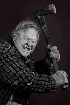 Crazy old man with axe Stock Photos