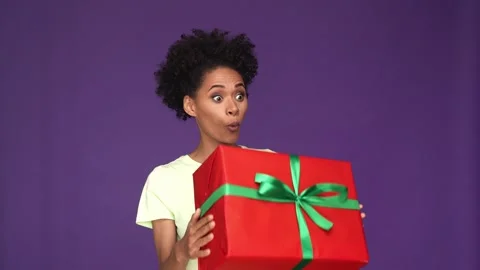 Crazy positive lady catch large gift isolated purple color background Stock Footage 165878490