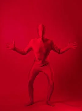 Crazy red man on a red background. figure in a leotard covering the whole body Foto stock