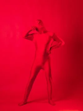 Crazy red man on a red background. figure in a leotard covering the whole body Foto stock