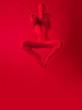 Crazy red man on a red background. figure in a leotard covering the whole body Stock Photos