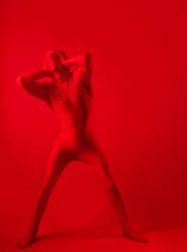 Crazy red man on a red background. figure in a leotard covering the whole body Foto stock