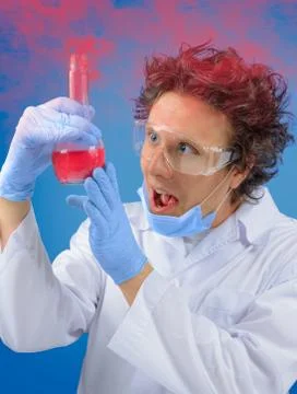 Crazy scientist examines flask Stock Photos