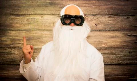 Crazy scientist old man  pointing up with her finger with some strange glasse Stock Photos