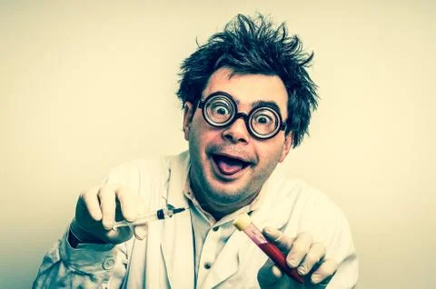 Crazy scientist performing experiments in laboratory Stock Photos