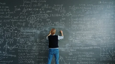 crazy-scientist-writing-formulas-chalkbo