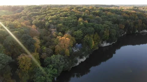 Crazy shot of house on cliffside with fall colors Stock Footage 141706082
