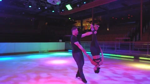Crazy spin rotation figure skating element with two skaters Stock Footage 137466756
