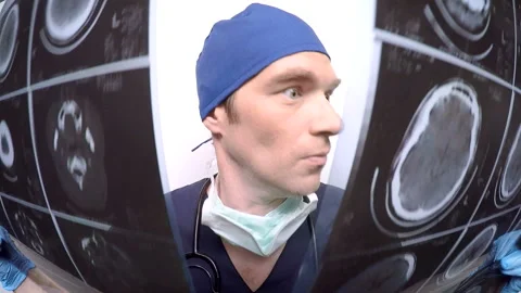 Crazy surgeon examine mri   Stock Footage 210514664