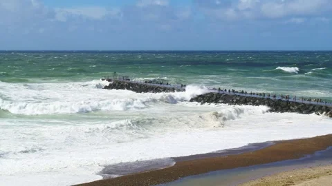 Crazy waves crashing hitting a pier at the North Sea in Denmark Stock Footage 335993300