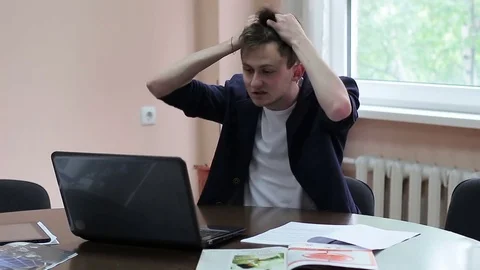 A crazy worker freaks out at the office. Stock Footage 75875694