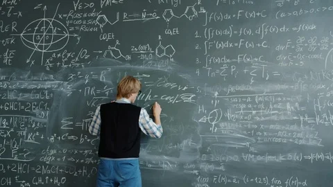 Crazy young man beating chalkboard yelling feeling angry because of science Stock Footage 124888383
