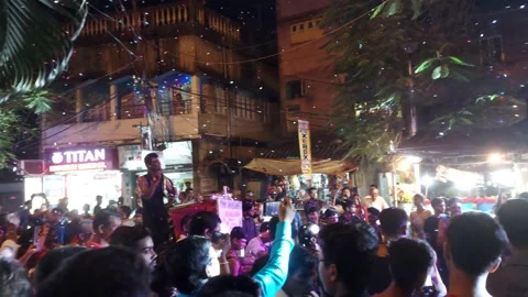 Crazy youth  dancing on road during immersion of idols Stock Footage 219953257