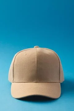 Cream baseball cap and copy space on blue background Stock Illustration