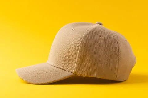 Cream baseball cap and copy space on yellow background Stock Illustration