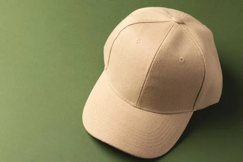Cream baseball cap and copy space on green background イラスト素材
