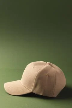 Cream baseball cap and copy space on green background Stock Illustration