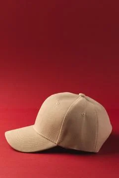 Cream baseball cap and copy space on red background Stock Illustration