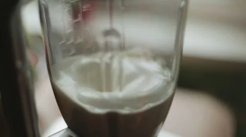 Cream being mixed in a blender Video stock 62818438