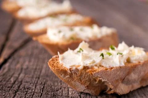 Cream on the bread Stock Photos