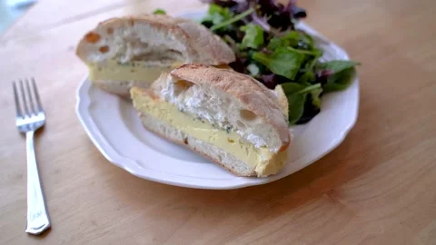 Cream cheese on a roll on the cafe table Stock Footage 131919335