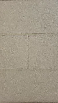 Cream colored abstract wall texture background with block design Stock Photos