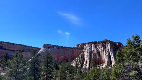 Cream colored cliffs rise in zion national park like ancient stone curtains Video stock 305569688