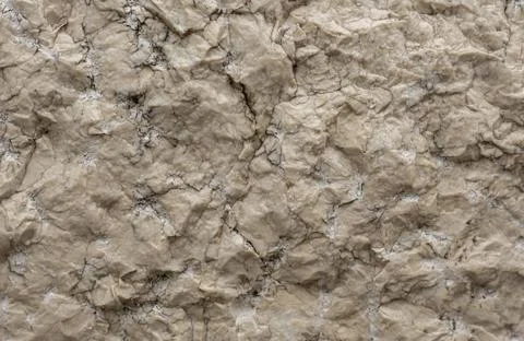 Cream coloured bumpy stone background 写真素材