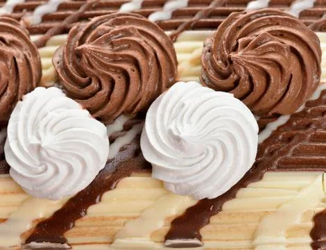 Cream decorations on a cake Stock Photos