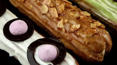 Cream dessert eclairs, rotating, closeup, loop Stock Footage 63853232