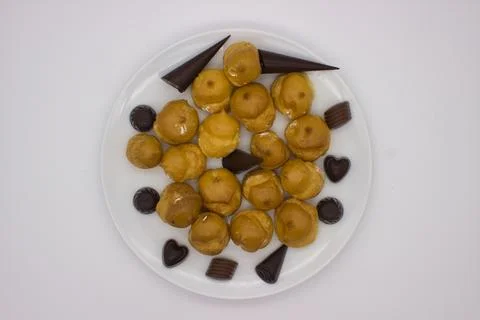 Cream-Filled Profiteroles with Assorted Chocolates Stock Photos