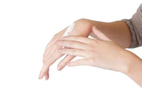 Cream on hands Stock Photos