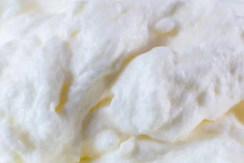 Cream macro shot as background Structure Stock Photos