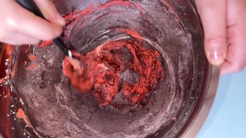 Cream mixed with dye and cocoa powder Video stock 230298199