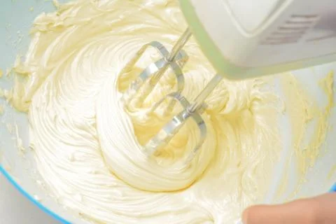 Cream is mixing using mixer Stock Photos